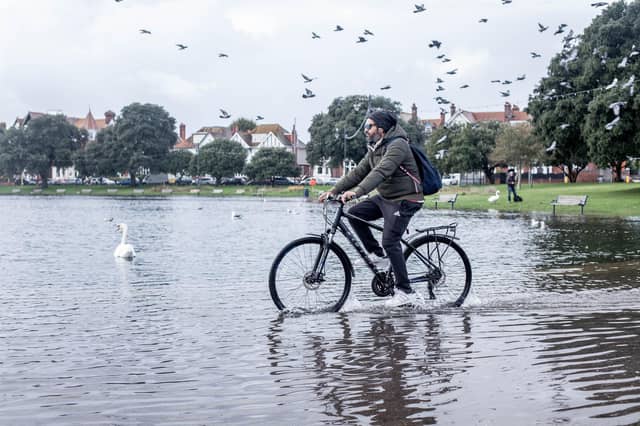 Flooding in Portsmouth on Monday, October 30 2023
Pictured: A man rides his bike by the flooded Canoe Lake, Southsea.
Picture: Habibur Rahman