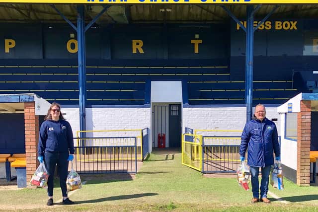 Gosport Borough FC volunteer Clare Kaznowski (left) and club Covid-19 community response coordinator Keith Slater with food parcels, donated by Aldi, for those in need of the town in front of the clubs main stand. Picture by Debra Redpath
