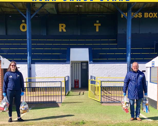 Gosport Borough FC volunteer Clare Kaznowski (left) and club Covid-19 community response coordinator Keith Slater with food parcels, donated by Aldi, for those in need of the town in front of the clubs main stand. Picture by Debra Redpath