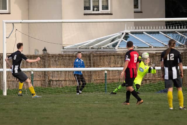 Adam Clark scores Hayling's fourth goal from the penalty spot at Locks Heath. Picture: Keith Woodland