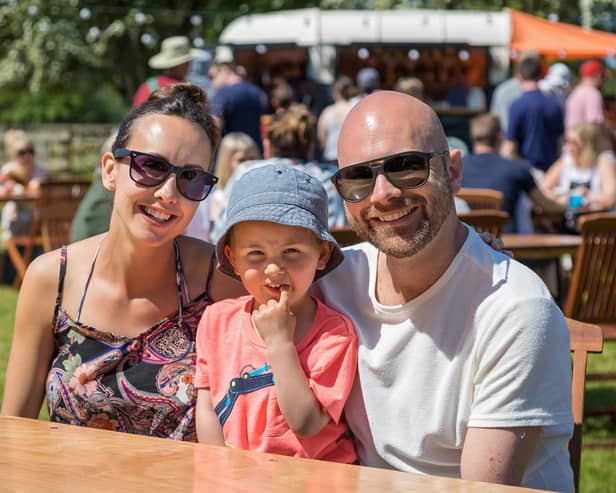 Rebecca Sheppard (34) with son Finley (3) and husband Ian Sheppard (38) enjoying a visit to Catherington Craft Fair. Picture: Mike Cooter (310521)
