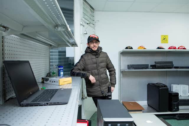 Paul's business partner, George O'Donnell, with some of the items to be sent out as online orders.

Picture: Habibur Rahman