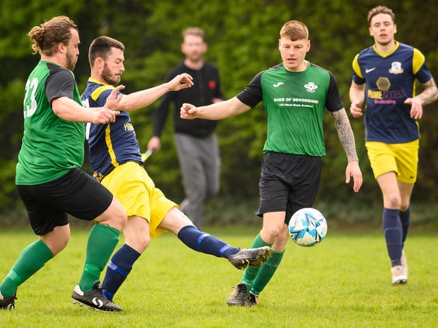 Action from Saturn Royale's 1-0 win over Pelham Arms (blue and yellow kit) in the second Adelaide Cup semi-final. Picture: Keith Woodland (300421-66)