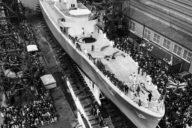 Hundreds of spectators watch the launch of HMS Andromeda in Portsmouth Dockyard in May 1967