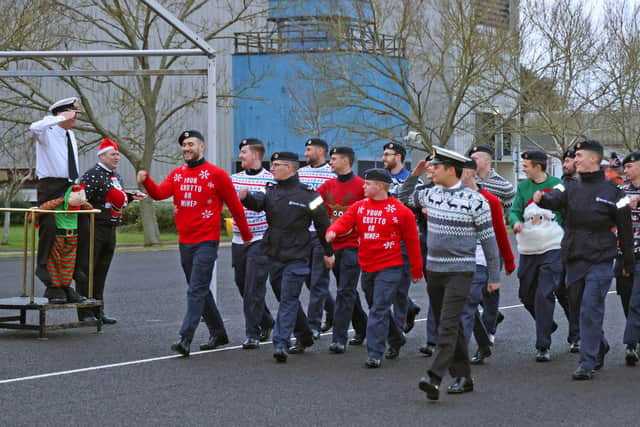 Christmas cheer was in full flow at HMS Sultan over the past week.
Pictured: Sailors wearing festive jumpers take part in a charity divisions event on the base's parade square.