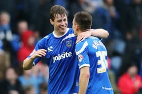 Match-winner Adam Webster celebrates with Jed Wallace after Pompey's victory over Hartlepool in April 2014. Picture: Joe Pepler