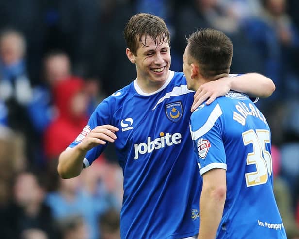 Match-winner Adam Webster celebrates with Jed Wallace after Pompey's victory over Hartlepool in April 2014. Picture: Joe Pepler