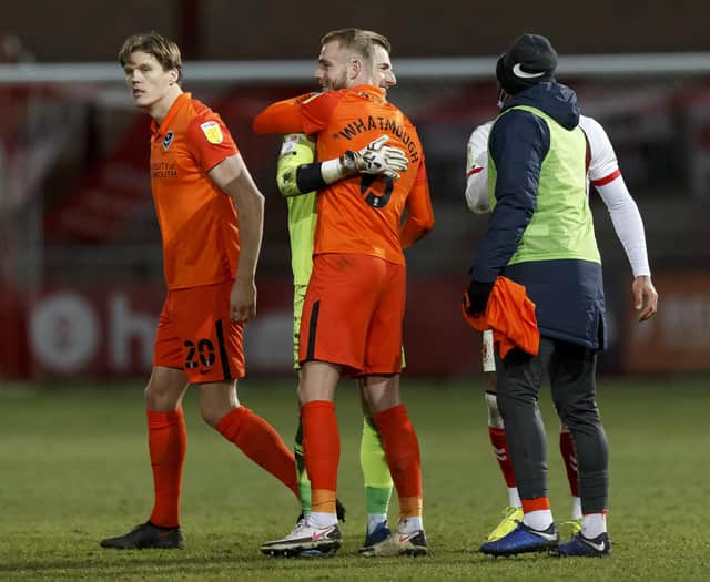 Craig MacGillivray and Jack Whatmough celebrate a Pompey win over Fleetwood - and fifth consecutive league clean sheet. Picture: Daniel Chesterton/phcimages.com