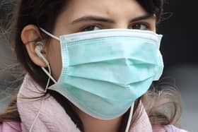 A woman wearing a face mask in Leeds Picture: Danny Lawson/PA Wire