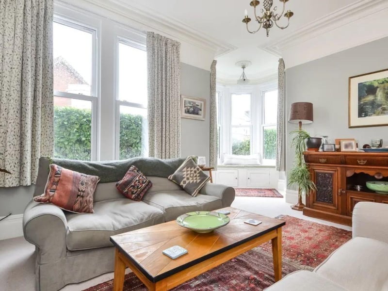 The listing says: "This impressive corner residence was built in the Edwardian period and captures a number of features including a turret double storey bay window, cast iron canopy, ceiling roses and coving and fire surrounds. The property has two primary floors to the front and three mezzanine levels to the rear and includes a basement playroom and store."