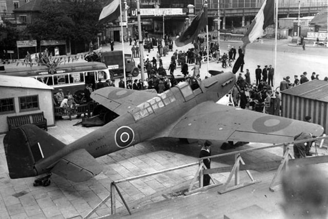 This marvellous shot taken from the steps of the Guildhall shows a fighter on display on the edge of Guildhall Square when it was on show for Wings for Victory Week in 1943.