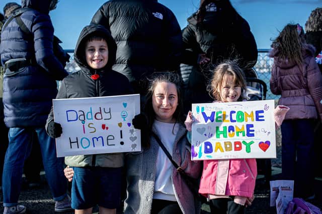 Pictured: Jade Brame, of Gosport, with Oscar, 8, and Harper, 5, waiting for Marcus to come home.