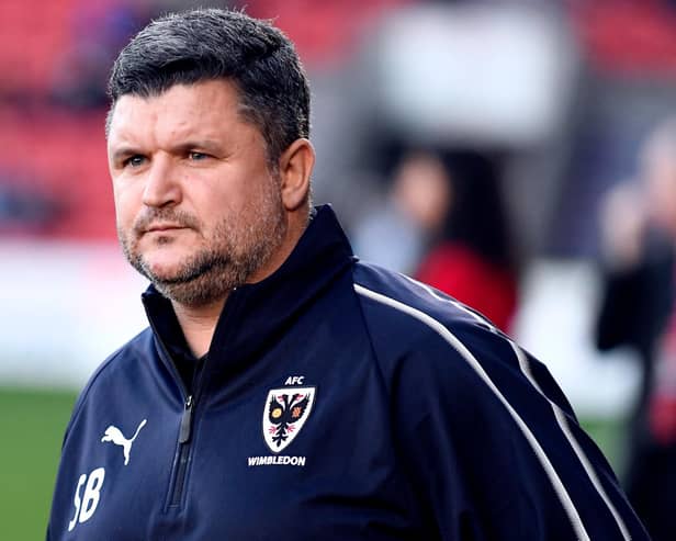 Lyle Taylor believes AFC Wimbledon's failure to replace Pompey coach Simon Bassey was they key reason why Mark Robinson was sacked as Wombles boss.