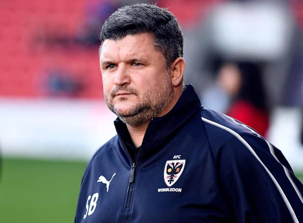 Lyle Taylor believes AFC Wimbledon's failure to replace Pompey coach Simon Bassey was they key reason why Mark Robinson was sacked as Wombles boss.