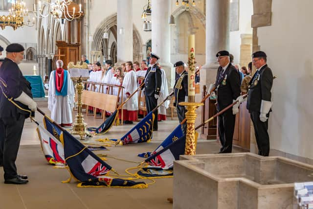 Standards lowered in memory of the lives lost at sea. Picture: Mike Cooter (021022)