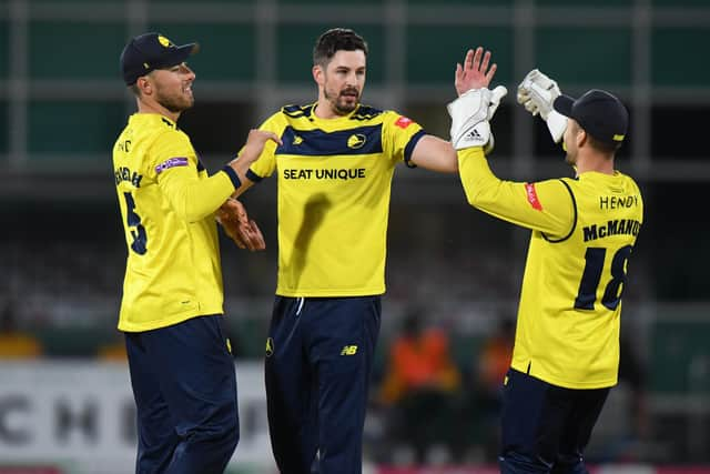 Hampshire's Chris Wood (middle) celebrates taking the wicket of Ben Slater. Photo by Tony Marshall/Getty Images.