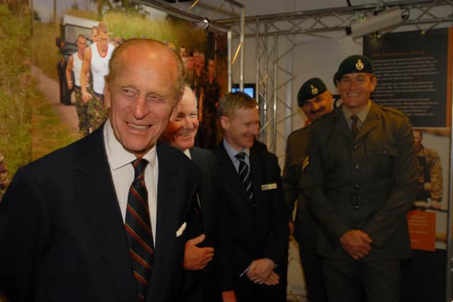 The Duke of Edinburgh at NMRN exhibition next to Royal Marines. Photo: NMRN