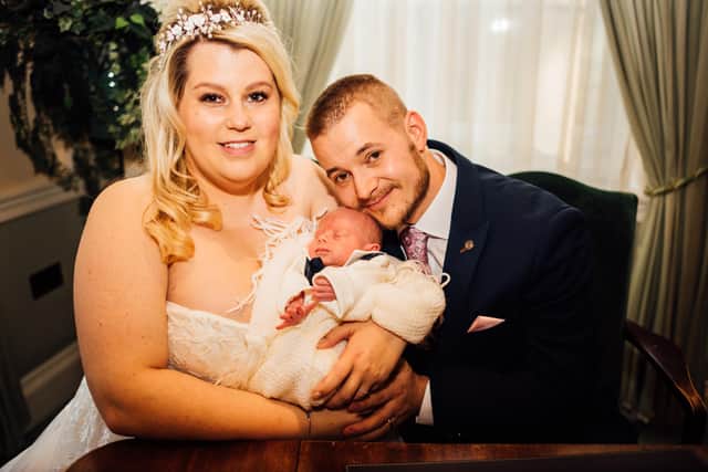 Vicky and Chris Mould with their son, Daniel, on their (second attempt at a) wedding day.