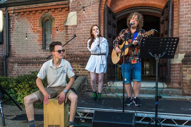 Tom Preston (20), Ashley Diffey (18) and Tom Davies (17) performing at the event. Picture: Mike Cooter (090621)