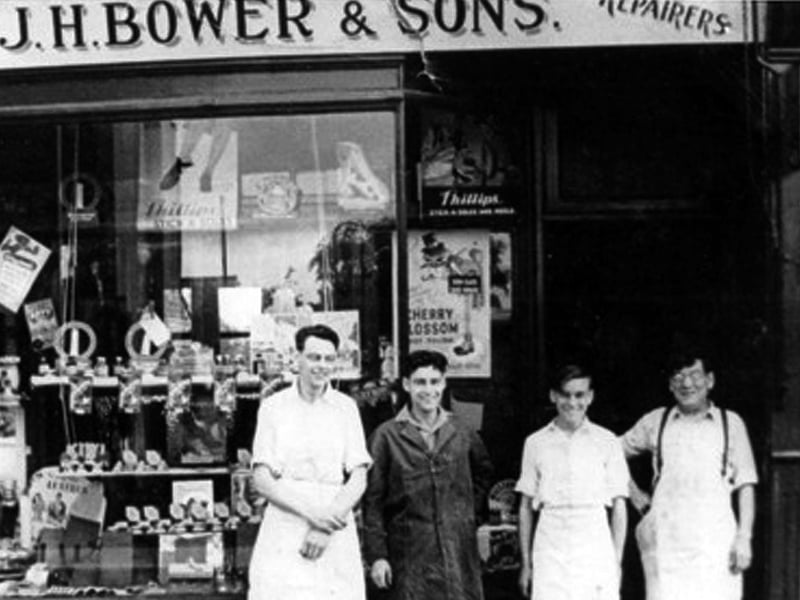 J H Bower and Sons. Dennis, third from the right, as a boy outside his late father's shop in Old Fawcett Road. To the right is his father and to his left his two brothers Roy and Eric. .