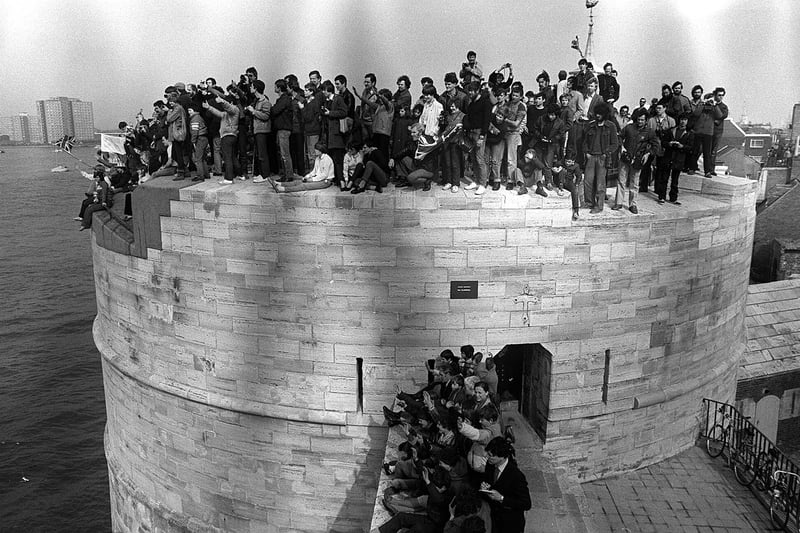 The Round Tower at Old Portsmouth with every vantage point taken by press and spectators watching the carriers Hermes and Invincible leave for the Falklands. Picture: The News 0573-8