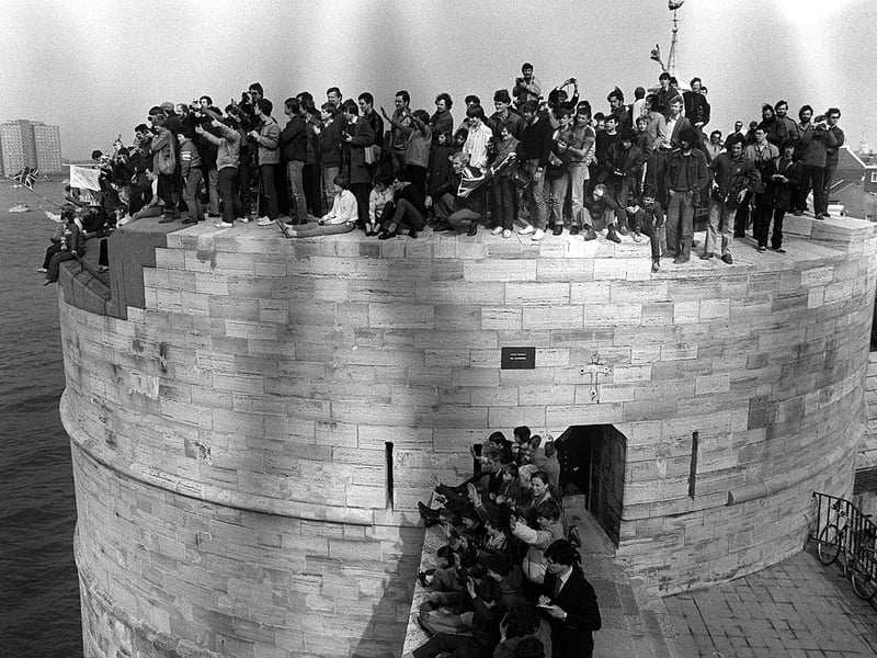 The Round Tower at Old Portsmouth with every vantage point taken by press and spectators watching the carriers Hermes and Invincible leave for the Falklands. Picture: The News 0573-8