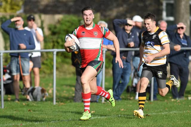 A Petersfield player about to run in another try during his side's London 3 South West win at Rugby Camp. Picture: Neil Marshall