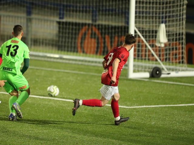 Camberley's Macauley Martin scores his second goal. Picture by Dave Haines.