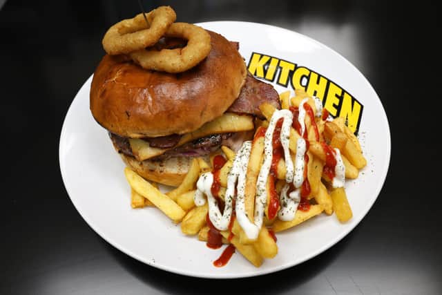 Barbecue bacon burger, with cheese, onion rings and fries with special mayo. The Grill Kitchen, Fratton RdPicture: Chris Moorhouse (jpns 240821-31)