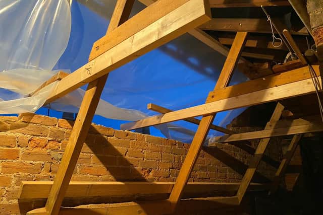 The hole left in Joe's loft after the wall collapsed.