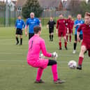 Burrfields (maroon) bear down on the Pompey Dynamos keeper. Picture: Mike Cooter