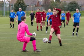 Burrfields (maroon) bear down on the Pompey Dynamos keeper. Picture: Mike Cooter