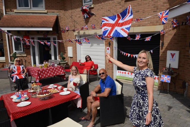 Faye McKenzie with husband Jonathan and daughter Grace as they host a party outside their Sunderland home.