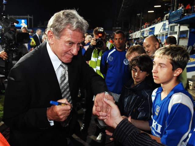 Milan Mandaric signs a few autographs before Pompey's home game against Bolton in 2006.