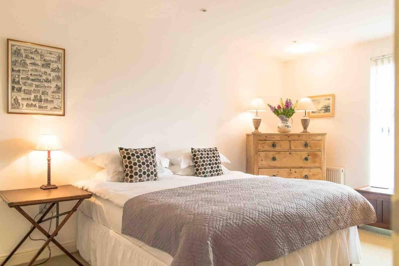 One of seven bedrooms, this bungalow has an array of light-feeling bedrooms.