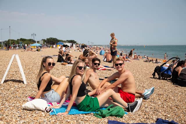 People enjoying one of the hottest day of the year in Southsea, Portsmouth on Monday 18th July 2022Pictured: Friends, Phoebe Balfe, Betsy Bagnell, Lenny Specer and Alfie Stringer at SouthseaPicture: Habibur Rahman