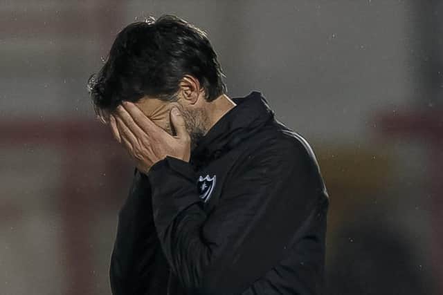 Danny Cowley is dejected at the final whistle of Pompey's 3-3 draw at Accrington. Picture: Daniel Chesterton/phcimages.com
