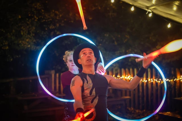 A juggler performing near the zoo's Cafe Graze