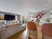 The property has a large open plan living area, with patio doors leading to the outside terrace area.