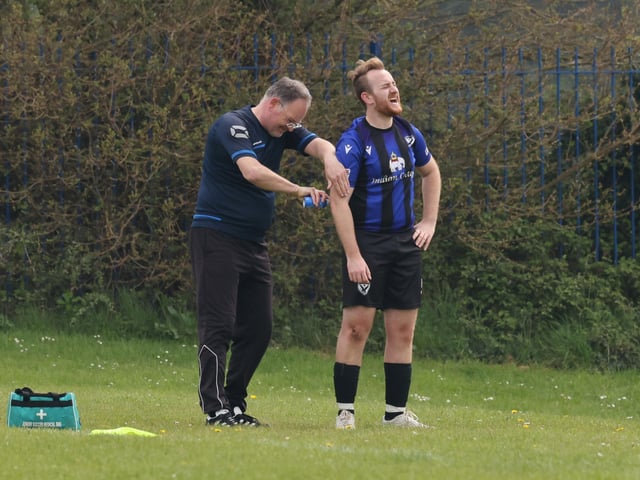A Horndean Hawks player receives treatment during their 6-1 loss against Pompey Chimes. Picture: Kevin Shipp