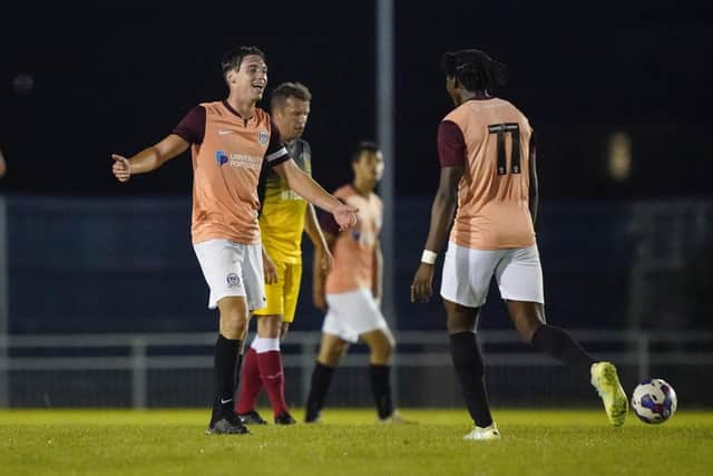 Spencer Spurway (left) celebrates netting Pompey's second goal in their Royal Artillery 125th Anniversary game. Picture: Jason Brown Photography