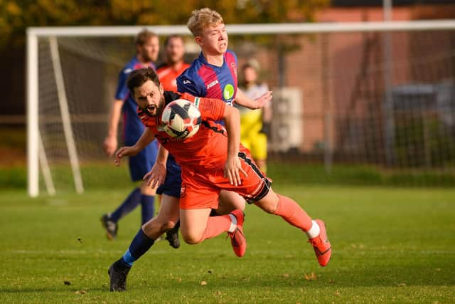 Portchester's George Barker is bought down by USP's Vinnie McGee
Picture: Keith Woodland