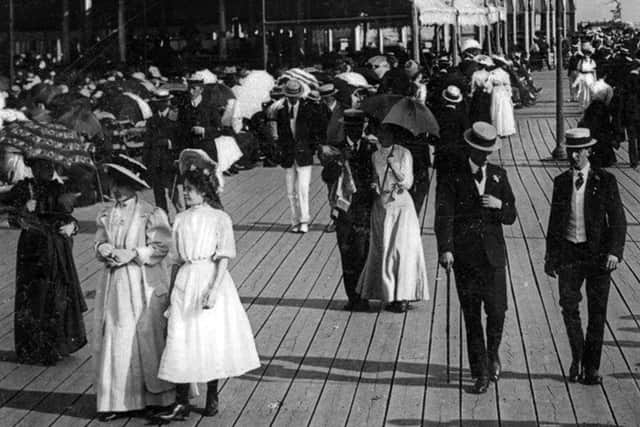 Boaters and parasols were the order of the day in this picture of sun-seekers on Clarence Pier, Southsea, about 1910. Picture: costen.co.uk