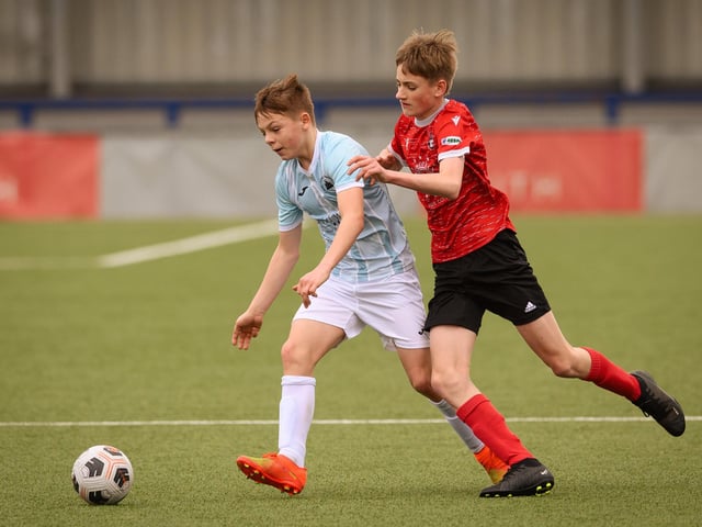 Action from the Portsmouth Youth League Geldard Invitation Cup final between Jubilee 77 U13s and Castle United U13s (light blue and white kit). Picture: Keith Woodland (190321-462)