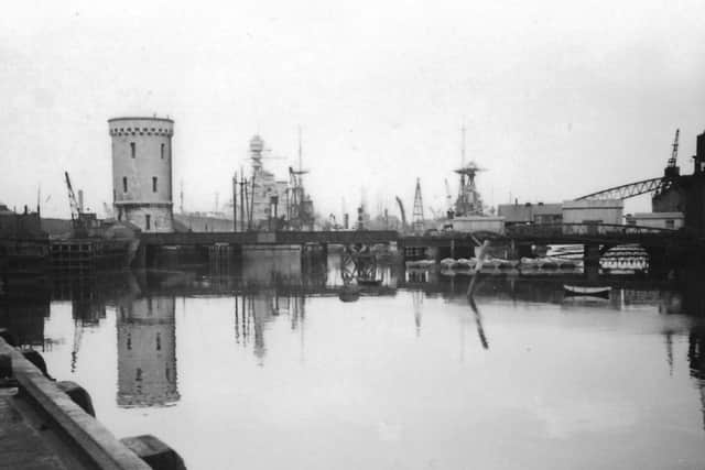 Can anyone tell me where this is in the dockyard and the name of the battleship too? Picture: Barry Cox collection.