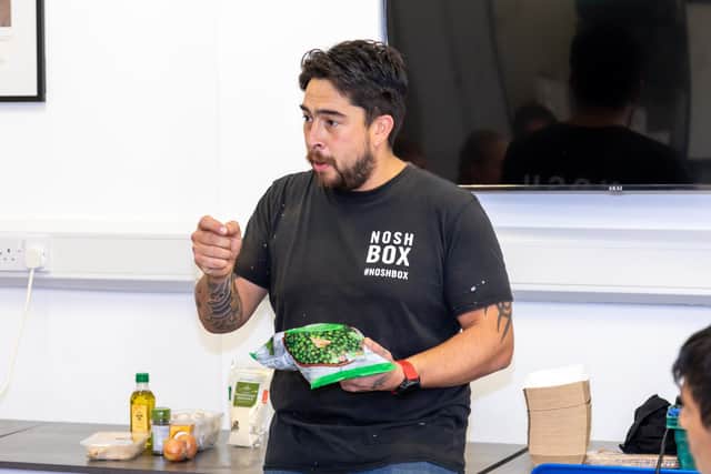 Development Chef John Brooke (42) explains the importance of ingredients at the Good Grub Club. Picture: Mike Cooter (231022)