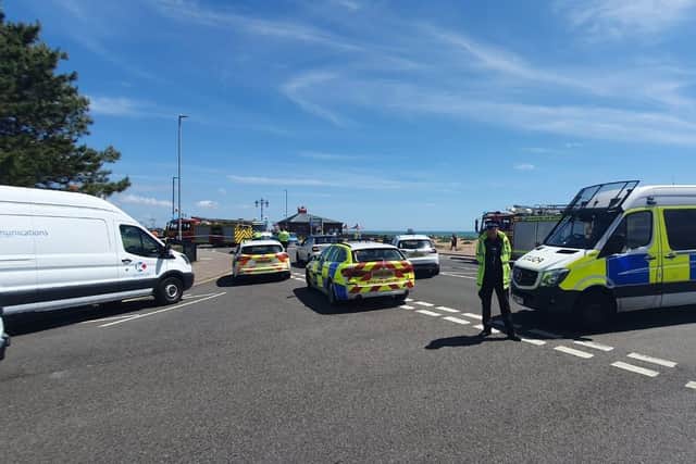 Emergency services on Eastney Esplanade in Portsmouth on June 28, 2022 after a car flipped near the junction with St George's Road. Picture: Habibur Rahman.