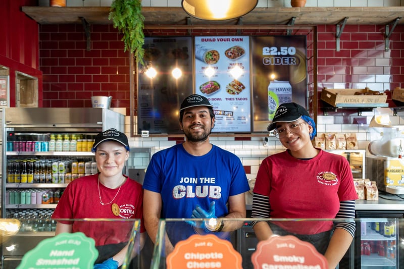 Shannon, Adwaith and Demi getting ready for the big burrito giveaway at Tortilla, Gunwharf Quays.Picture: Mike Cooter