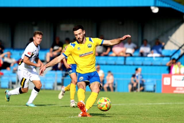 Sub Bradley Tarbuck scores Gosport's fifth goal from the penalty spot. Picture by Tom Phillips.