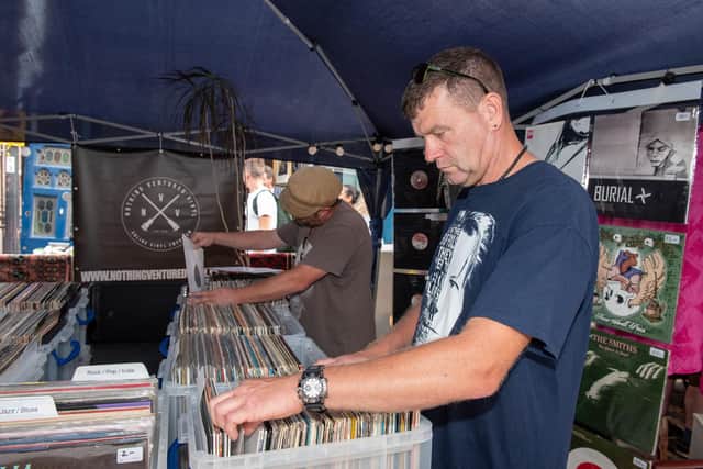 The Summer Fayre held at Castle Road in Southsea - Looking through LPs at Alex Cave's record stall. Picture: Vernon Nash (180410-003)